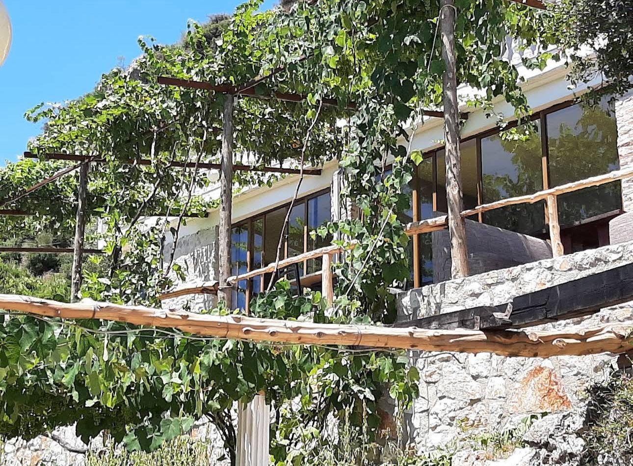 Roadside Property for Sale in Piqeras – Two-Storey Building with Private Yard